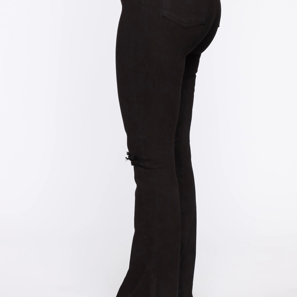 Black Fashion Nova Flare knee cutout jeans. Size 13. Only worn a fews.